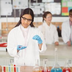 school-girl-experimenting-with-chemical-in-laboratory-at-school.jpg